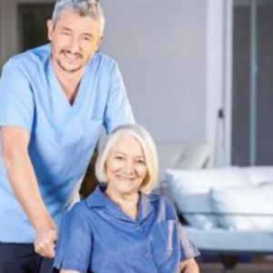 Caregiver with elderly woman in wheelchair | elderly care services | Neighborly Home Care